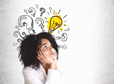 Woman pondering a question and getting an idea