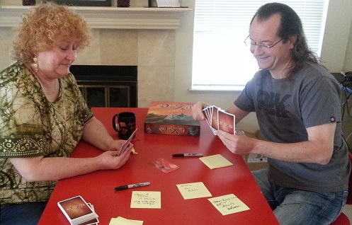 Team playing Dixit retrospective game