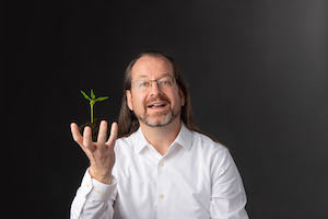 Chris Sims with a plant.